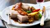 Roast belly of pork with root vegetables