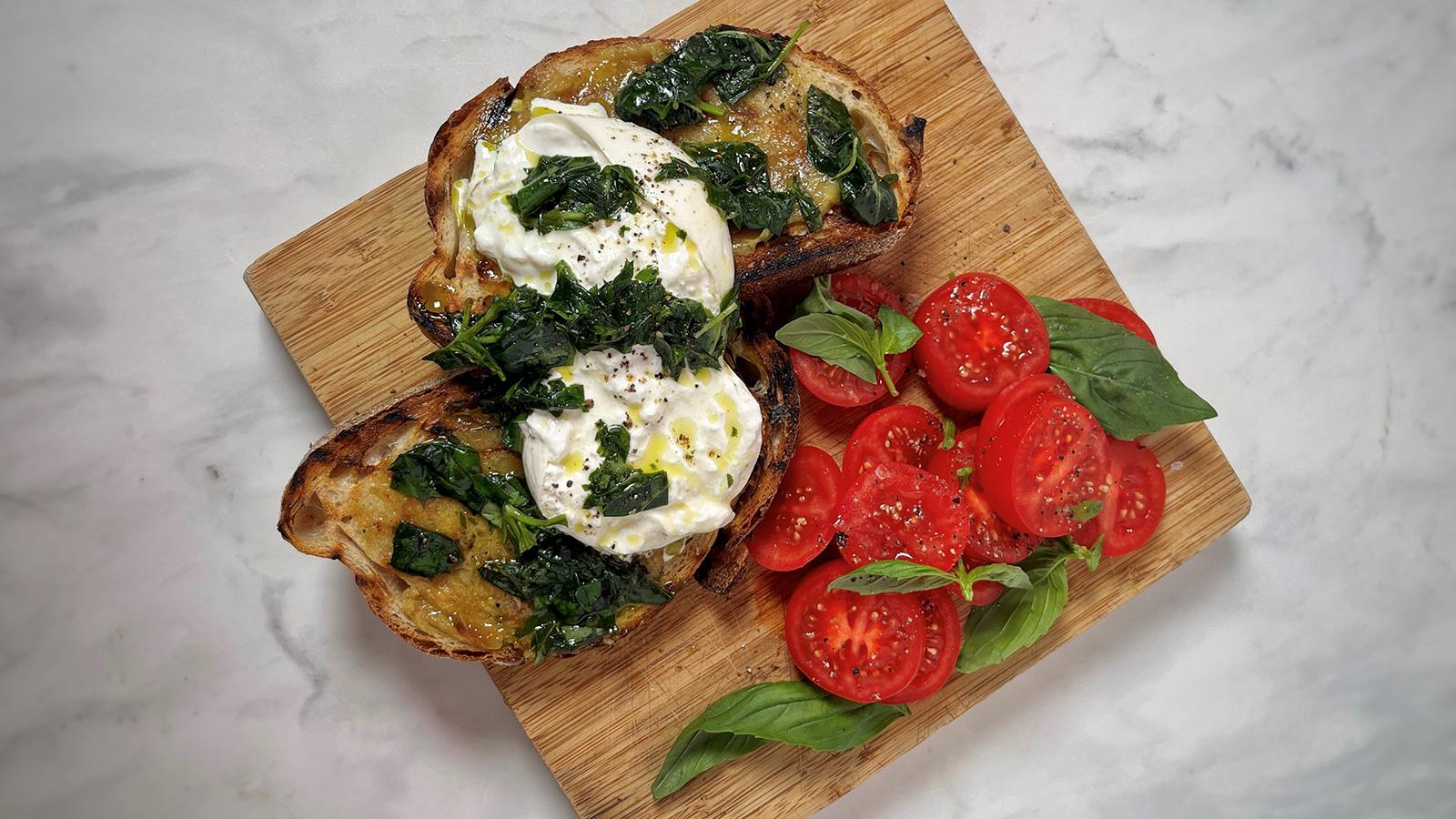 Bruschetta with roasted garlic, burrata and bruised basil