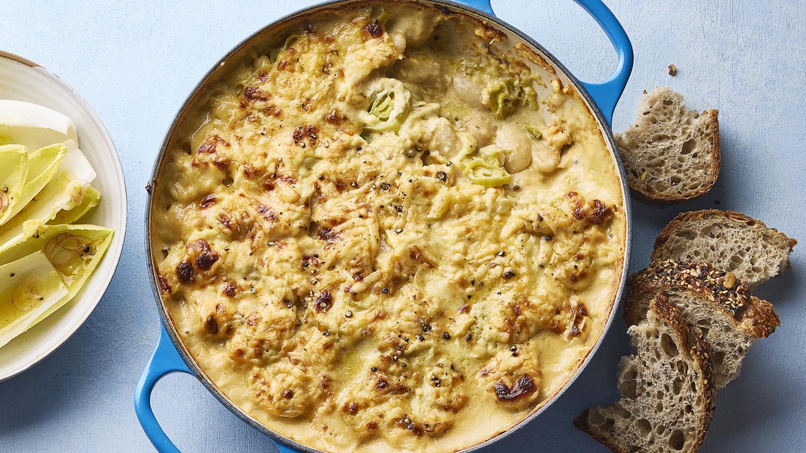 Cheddar, leek and butter bean bake with chicory salad