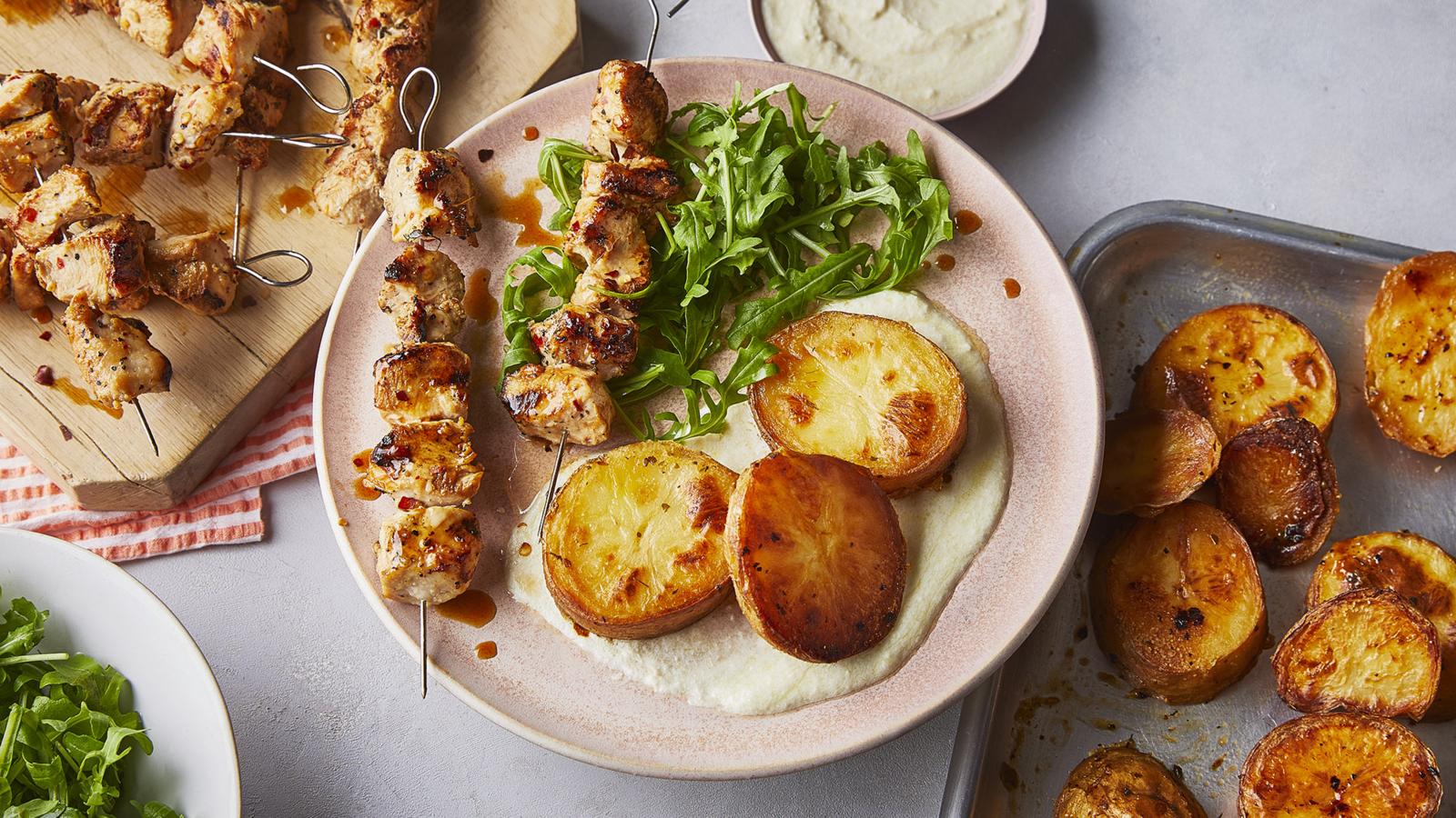 Chicken skewers with lemon-roasted potatoes recipe - BBC Food