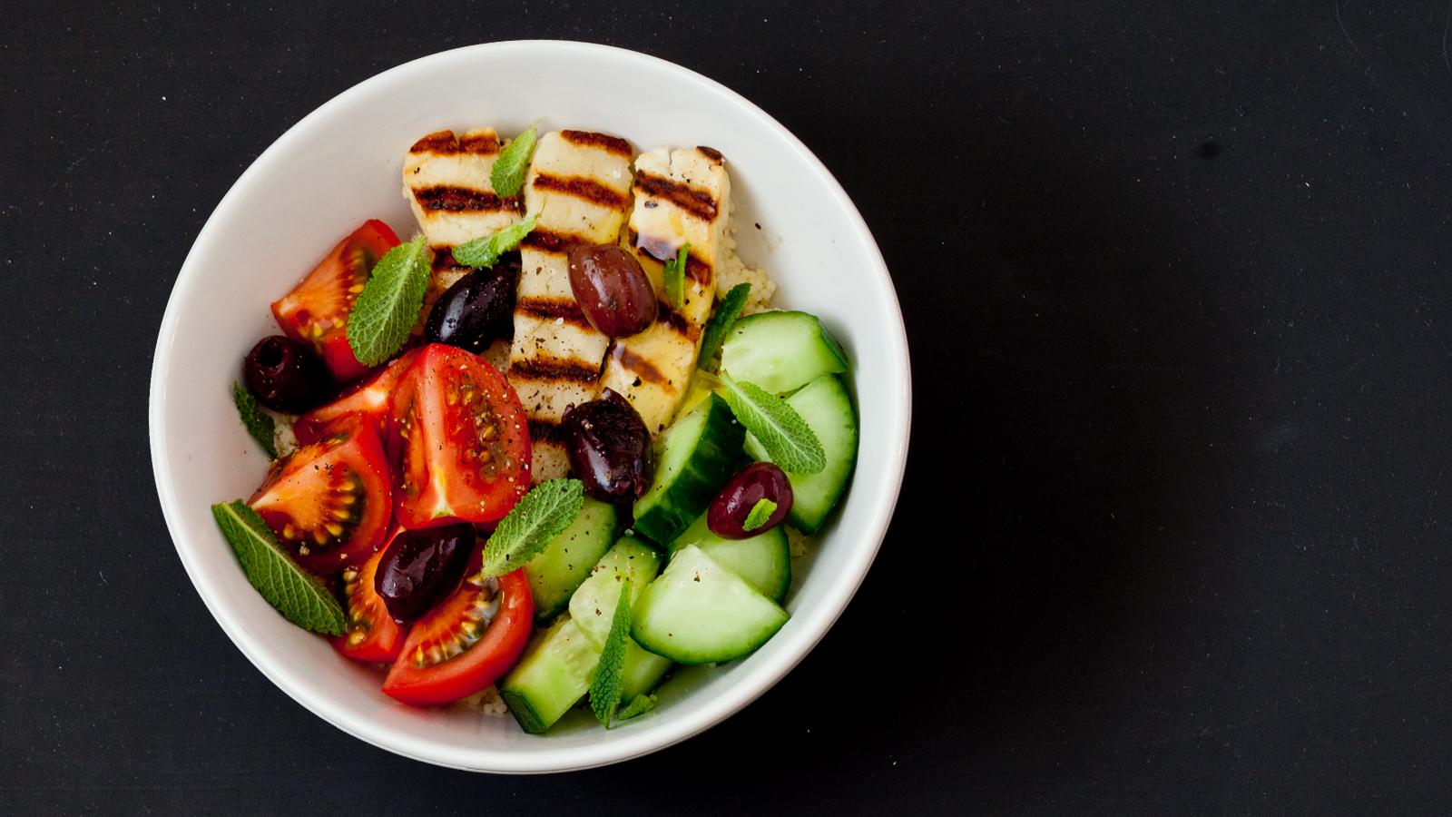 Halloumi, tomato, cucumber and couscous grain bowl