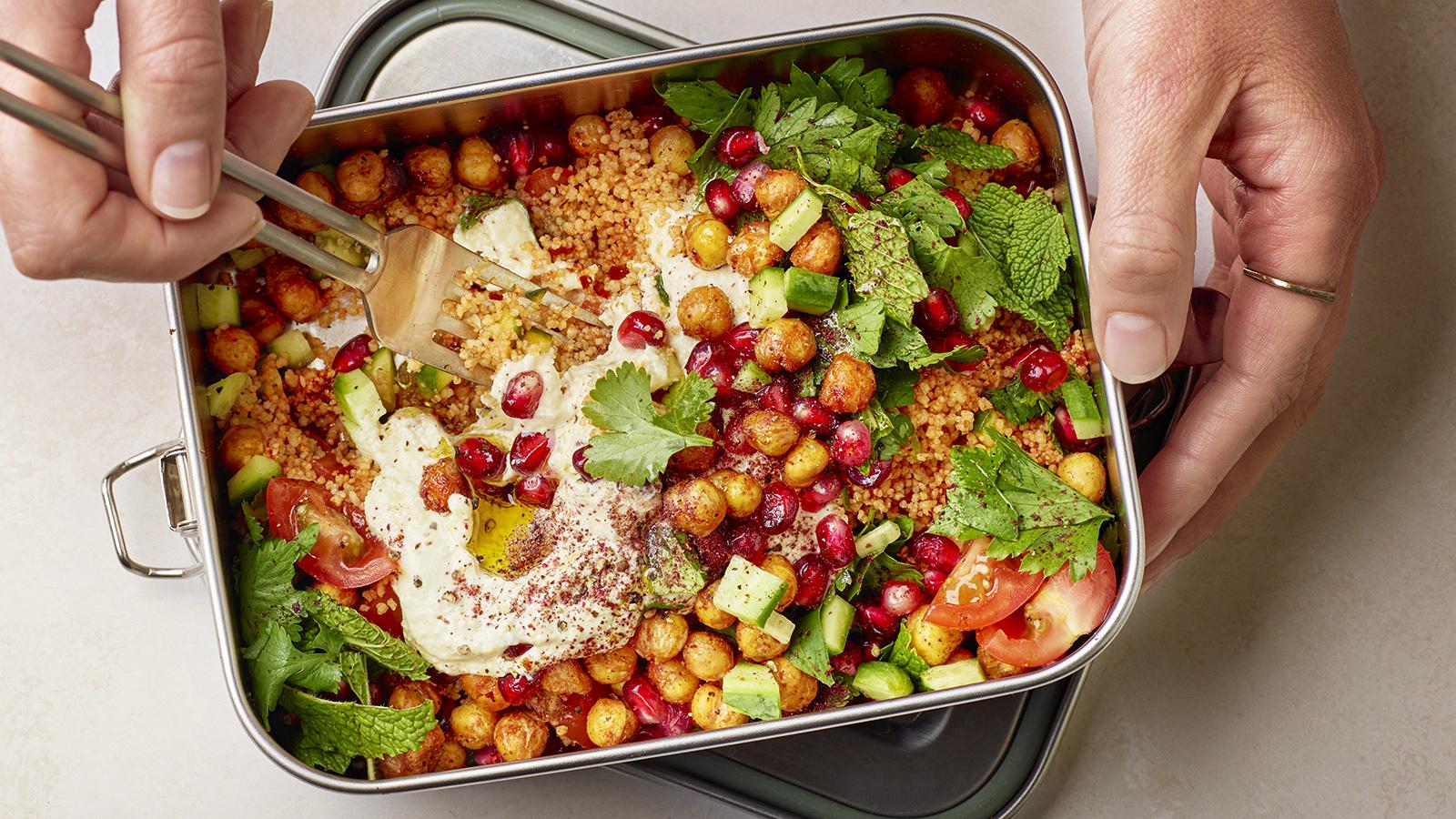 Harissa couscous with crispy chickpeas, hummus and herbs