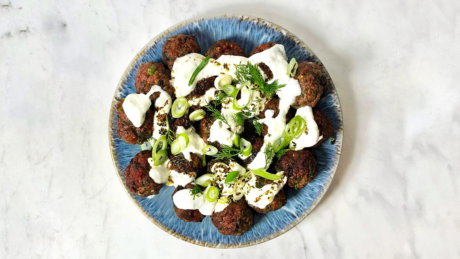 Herb koftas with warm yoghurt sauce