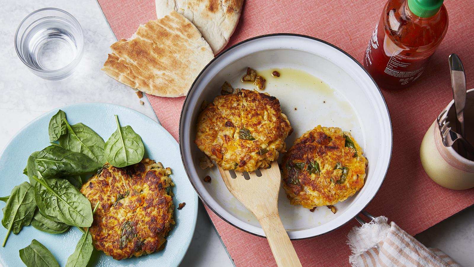 Leftover risotto fritters, with toasted pitta and spinach