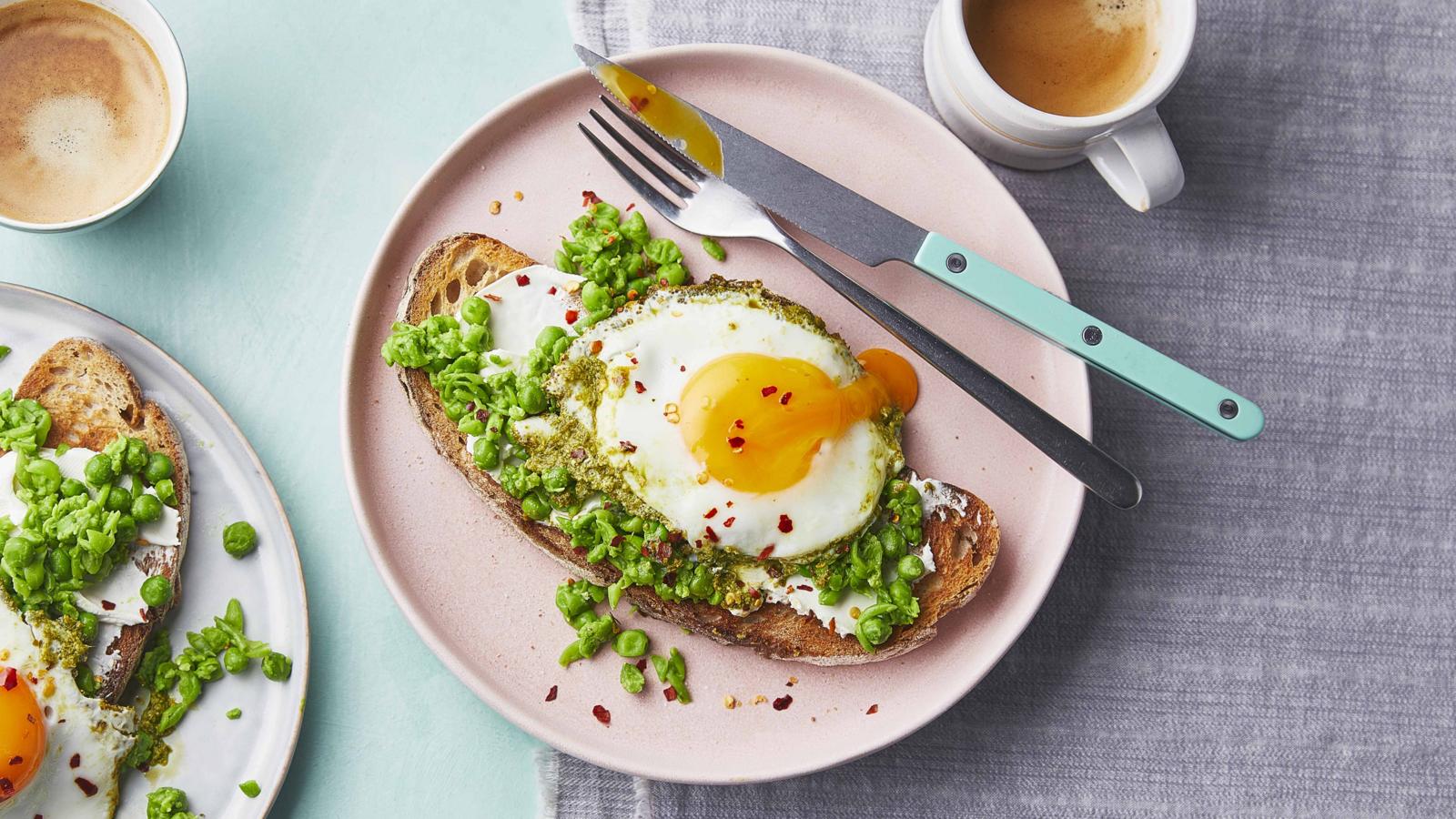 Pesto eggs with crushed peas on toast