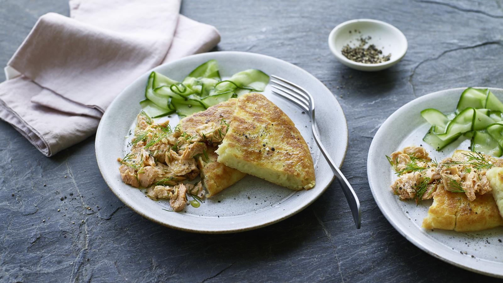 Potato bread with salmon and pickled cucumber