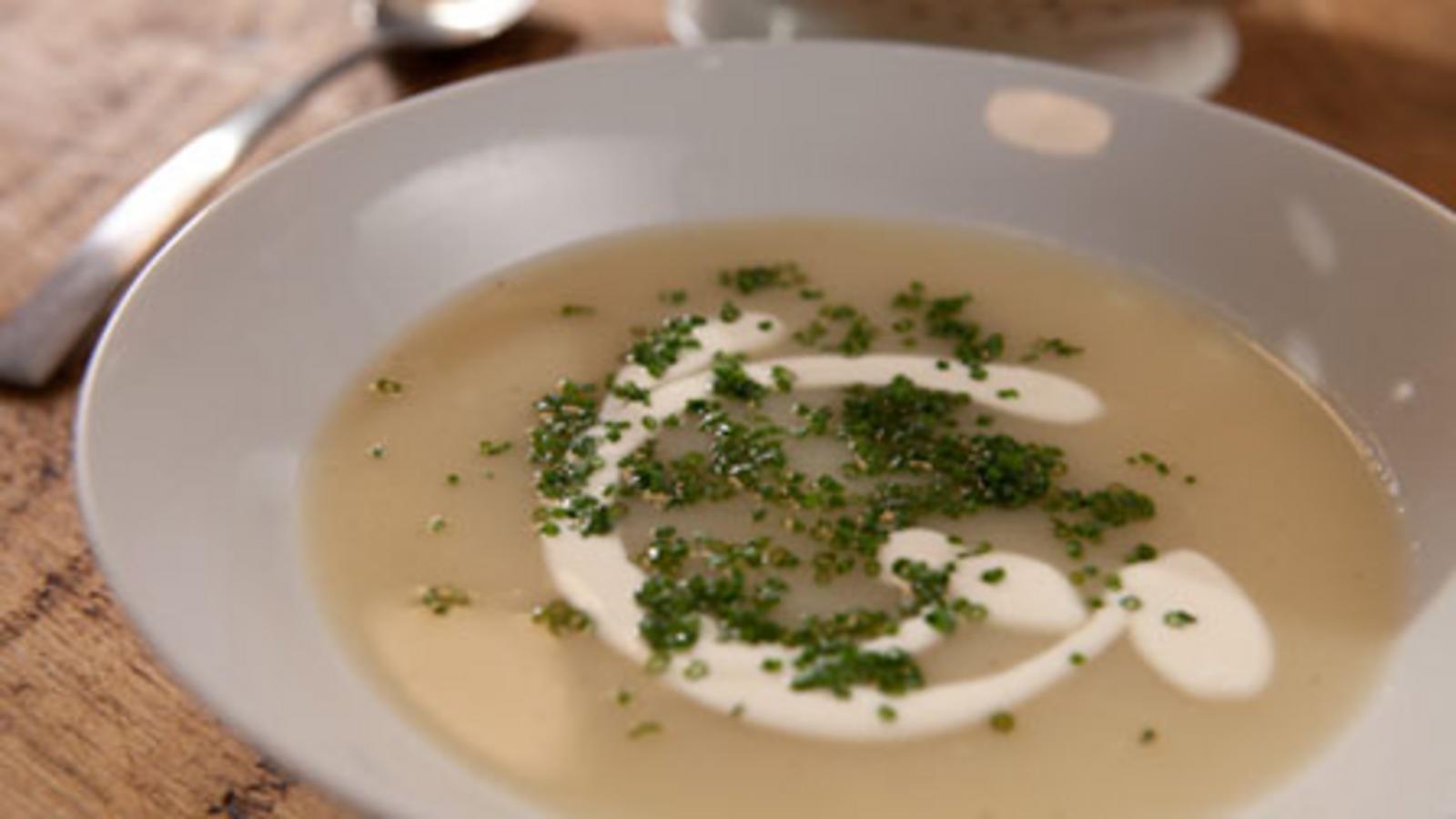 Potato soup with soured cream and chives