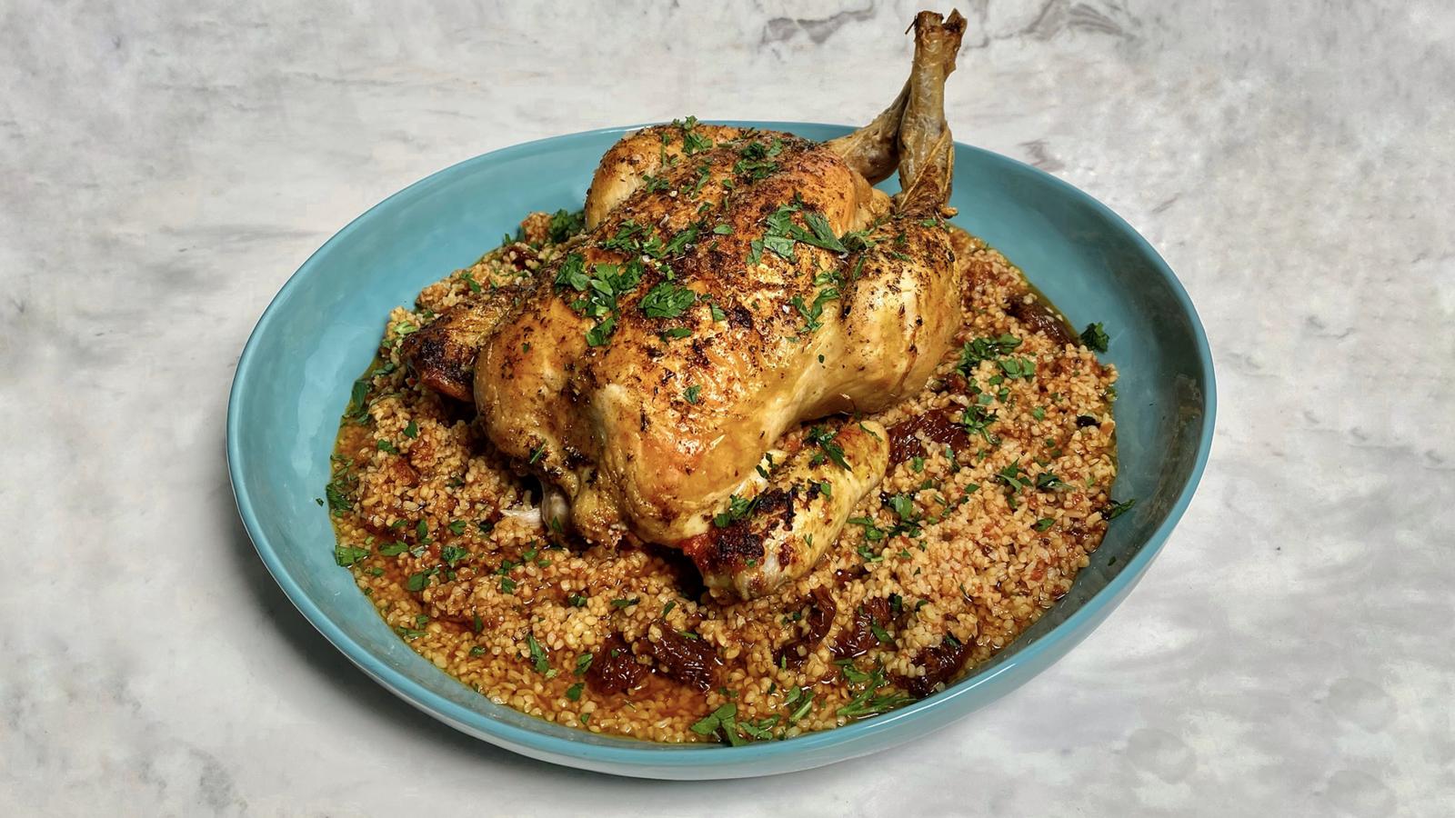 Roast chicken with tomatoey bulgur wheat, dilly leeks and peas