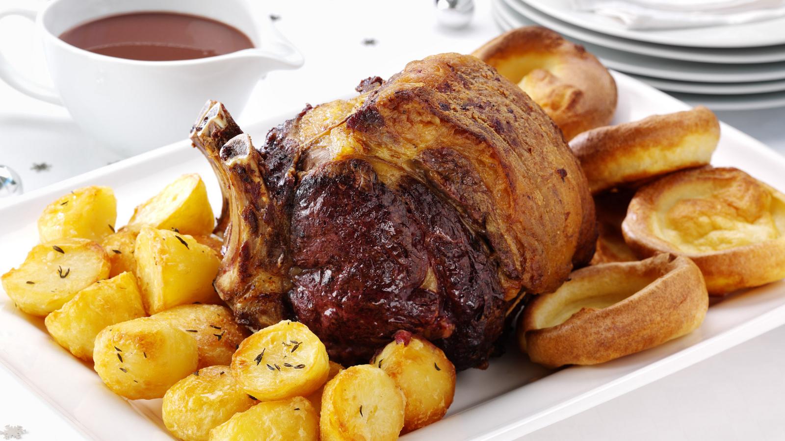 Roast beef with Yorkshire puddings, roast potatoes and gravy