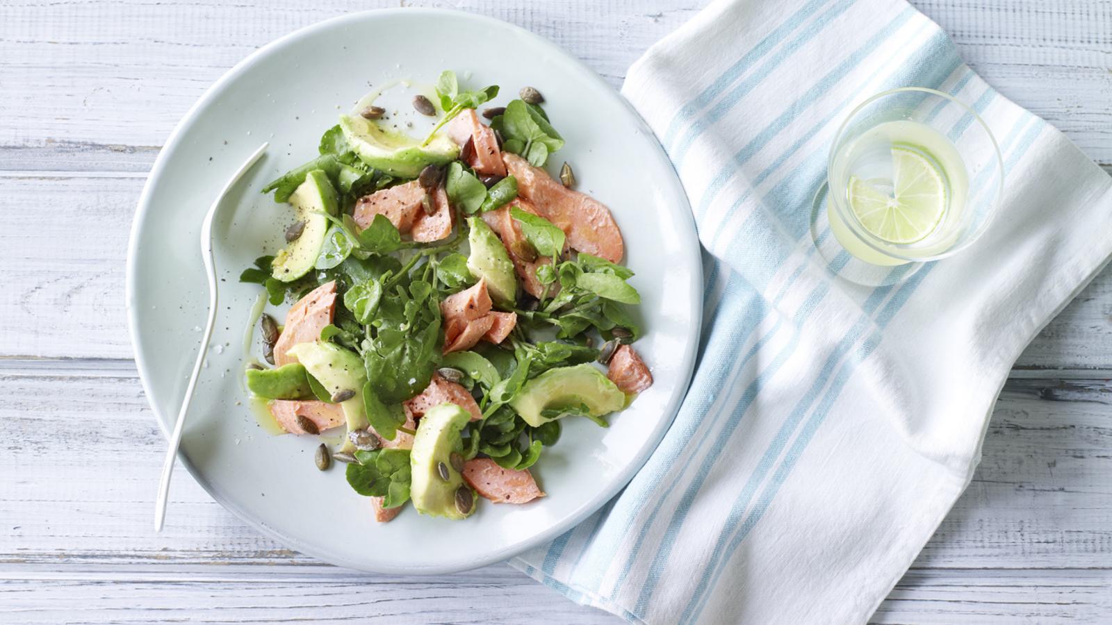 Salmon, avocado, watercress and pumpkin seed salad