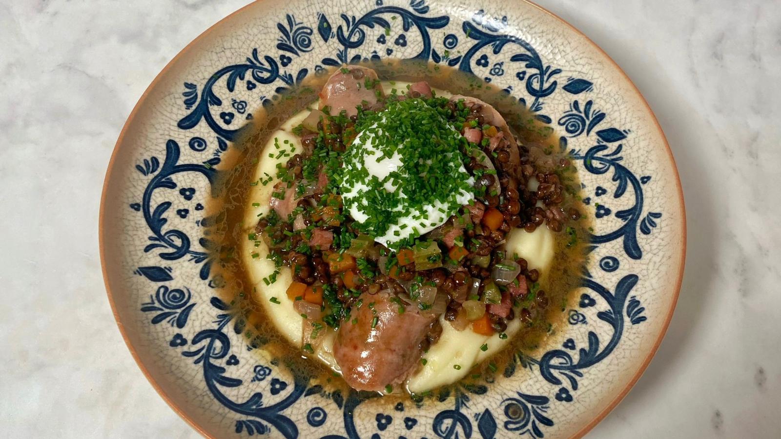 Sausages with braised lentils, mash and poached eggs