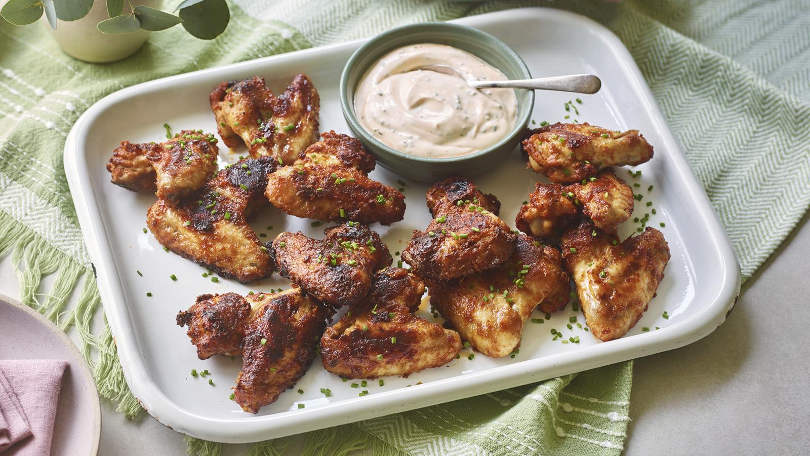 Sriracha chicken wings with sriracha and sour cream dip 