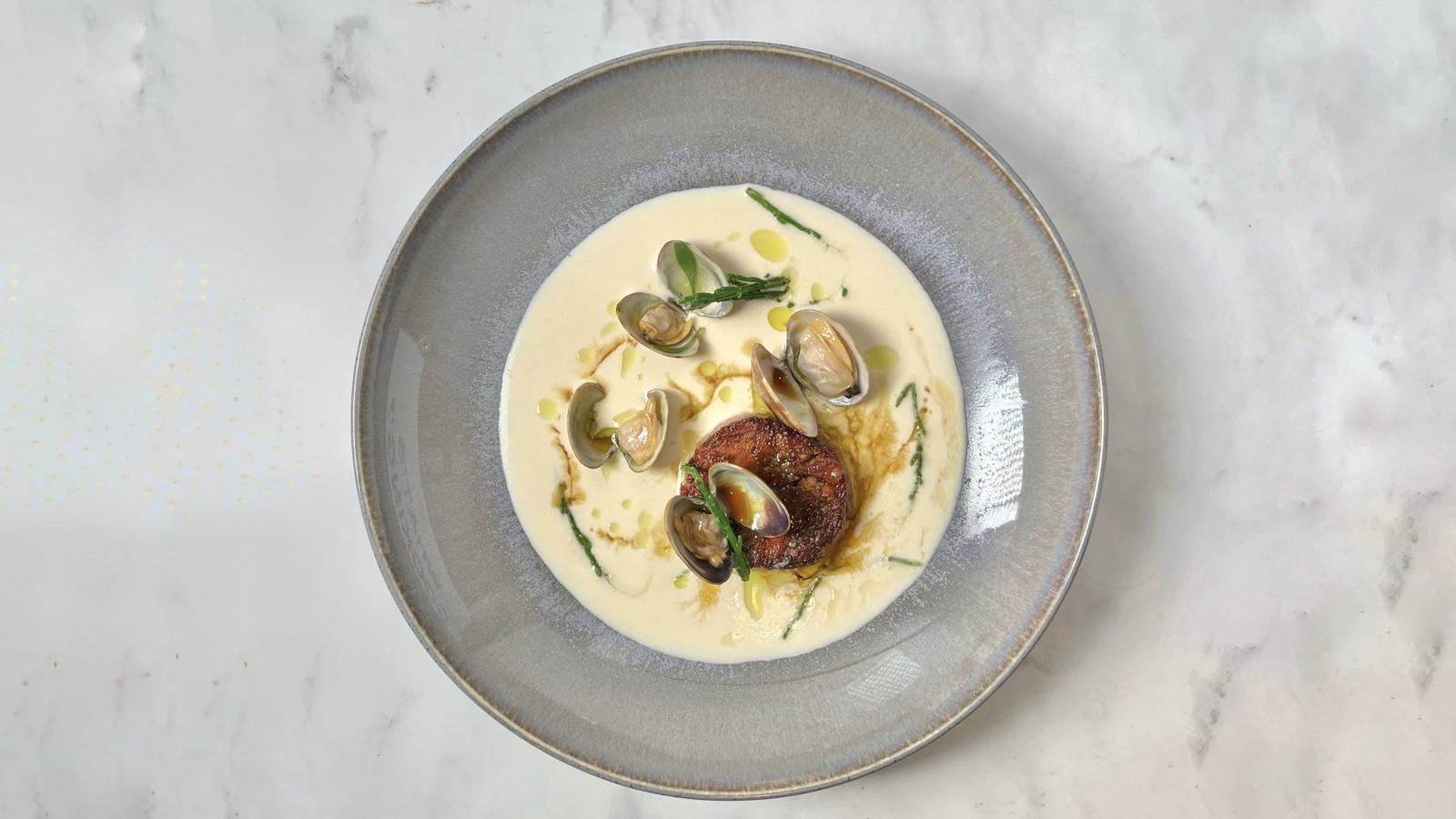 Tapa of lamb shoulder, ajo blanco, cockles and sea herbs