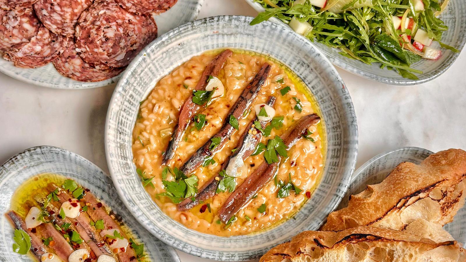 Tomato water risotto, rocket salad and anchovy dressing
