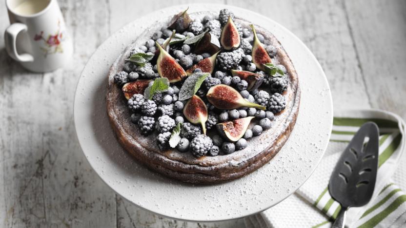 Baked cheesecake with blackberries, blueberries and  figs 