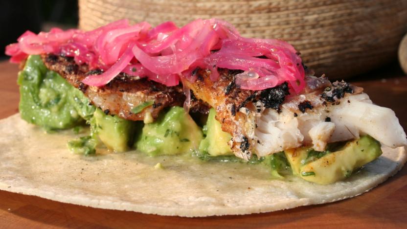 Crisp sea bass tacos with pink pickled onion