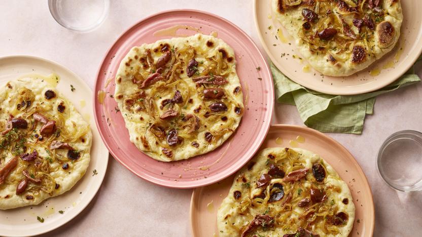 Flatbreads with caramelised onion, olives, thyme and anchovies