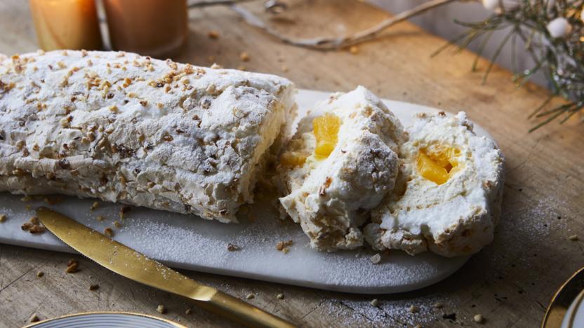 Hazelnut meringue roulade with white chocolate and clementine