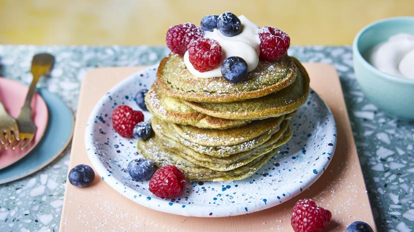 Matcha pancake stack with coconut yoghurt and fresh berries