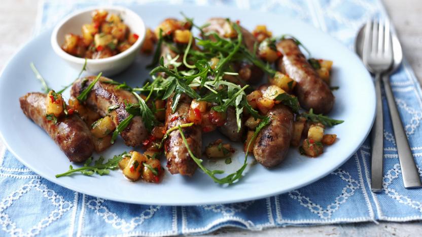 Pork sausages with pineapple salsa and rocket salad 