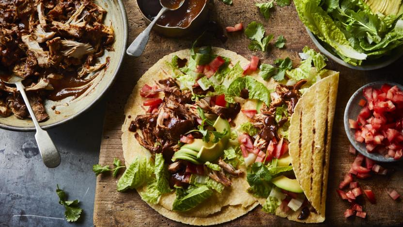 Pulled chicken tacos with chocolate mole sauce