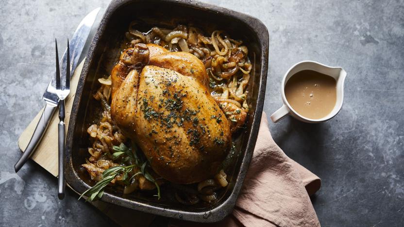 Roast chicken with tarragon butter and melting onions