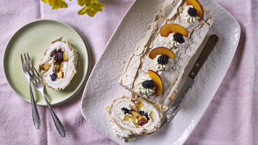 Rolled pavlova with peaches and blackberries
