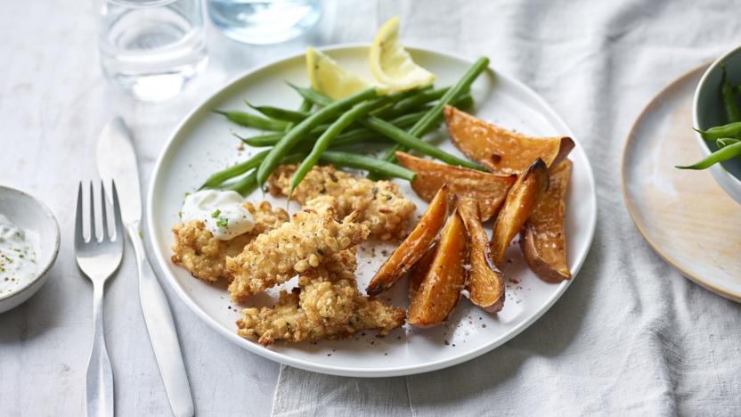 Spiced puffed rice chicken goujons with sweet potato wedges