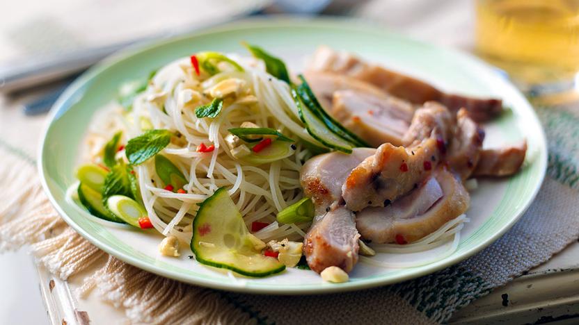 Spicy chicken thighs with cucumber and cashew salad