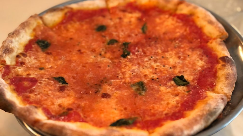 Danielle Oteri Pizza at Mario's has been made the same way since 1919 – a culinary artefact showing how the dish was introduced to Americans by immigrant chefs (Credit: Danielle Oteri)