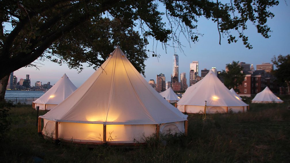 dpa picture alliance/Alamy Travellers to New York can now glamp on Governors Island with views of the Statue of Liberty and the Manhattan skyline (Credit: dpa picture alliance/Alamy)