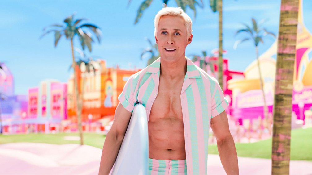 Alamy/Warner Bros Ryan Gosling as Ken in the film Barbie, holding a surfboard
