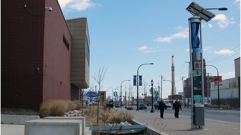 Getty Images A wind and solar generator powers streetlights and a pond to divert storm water from sewers on 'the greenest street in America', in Chicago in 2013 (Credit: Getty Images)