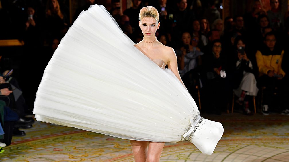 Getty Images Viktor & Rolf’s catwalk show featured tulle ball gowns worn at unexpected angles (Credit: Getty Images)
