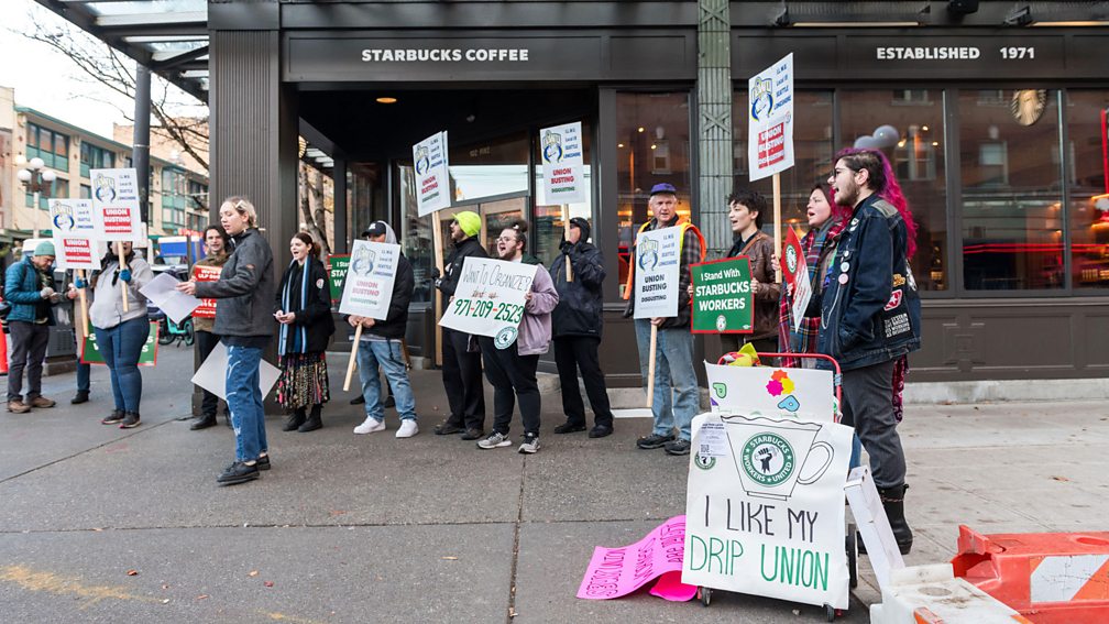 Alamy Strikes rolled across many US states, including Washington, where protestors and allies marched outside the iconic 1st and Pike Starbucks in Seattle (Credit: Alamy)