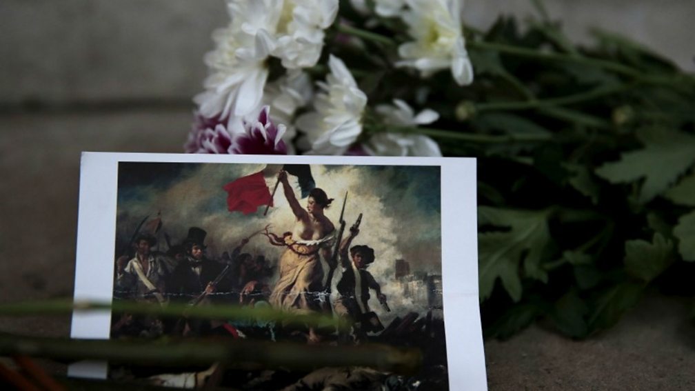 Flowers and a card left in Paris after the attacks