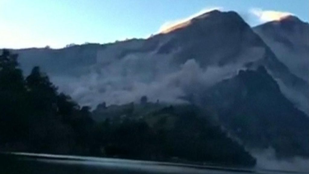 Trapped hikers descend quake volcano