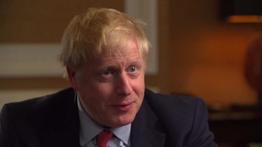 Johnson defends Brexit plan and silence over row