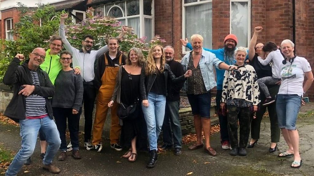 Neighbours fly rainbow flags to support victim of homophobic abuse