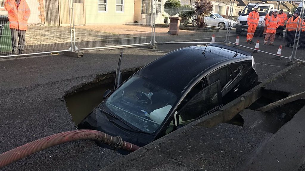 Brentwood sinkhole: car falls in hole and houses evacuated