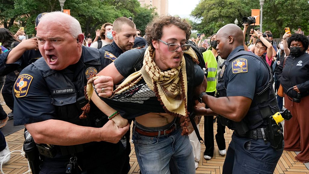 House speaker Mike Johnson heckled by protesters in tense campus visit