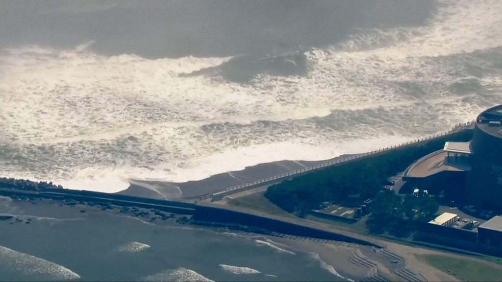 Tsunami alerts scaled back after huge earthquake prompts evacuations across Pacific - BBC News