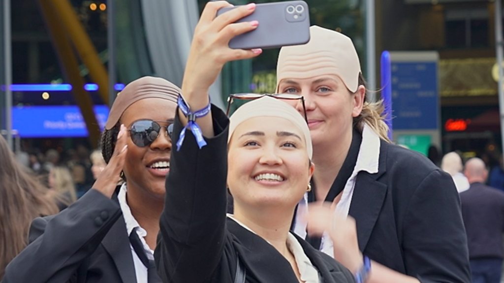 Thousands of UK Fans Wear Bald Caps at Pitbull Concerts