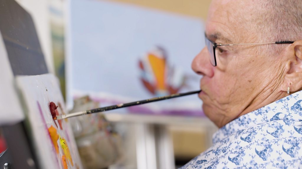 Mouth painter's work printed on Christmas card