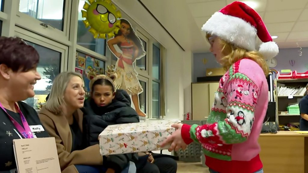 Girl who spent Christmas in hospital returns with gifts