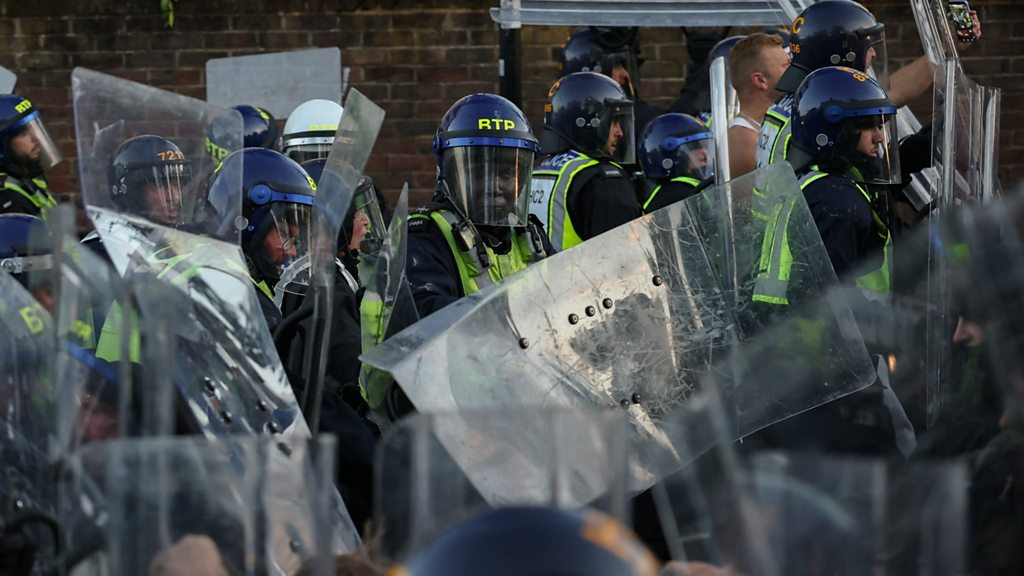 Protesters and riot police clash near home of Nowak’s killer
