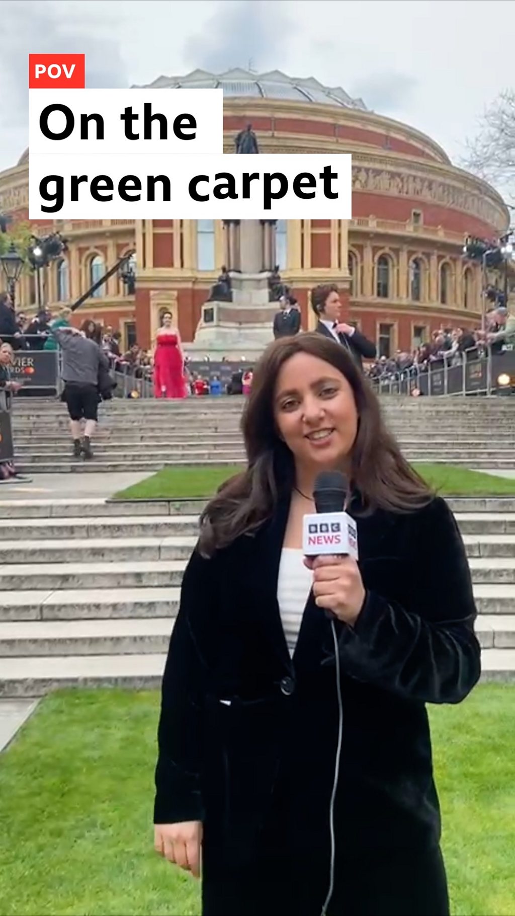 A woman stood on a 'green carpet' of grass in front of the Royal Albert Hall