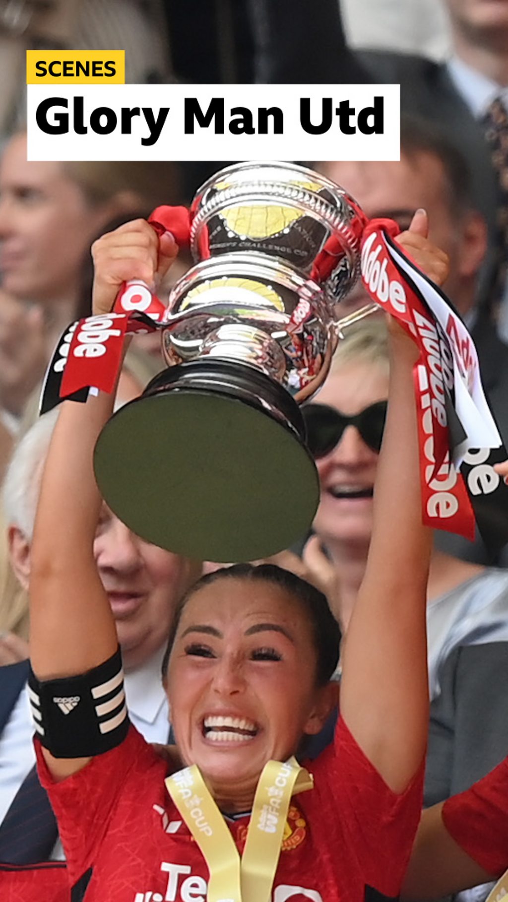 Katie Zelem lifts the FA Cup trophy