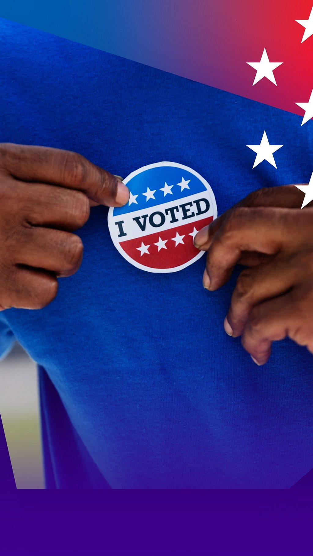 A man putting a sticker on his shirt that reads 'I voted'