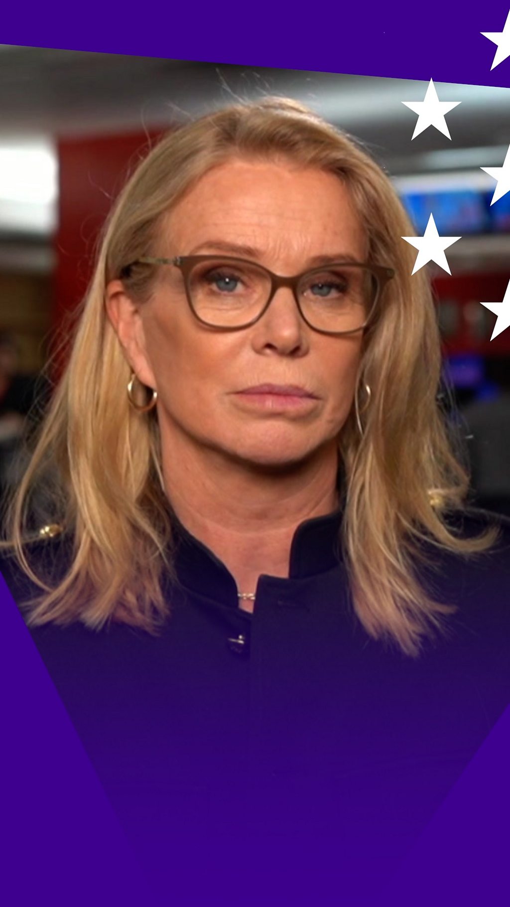 A woman, Katty Kay - she has long blonde hair and wears glasses